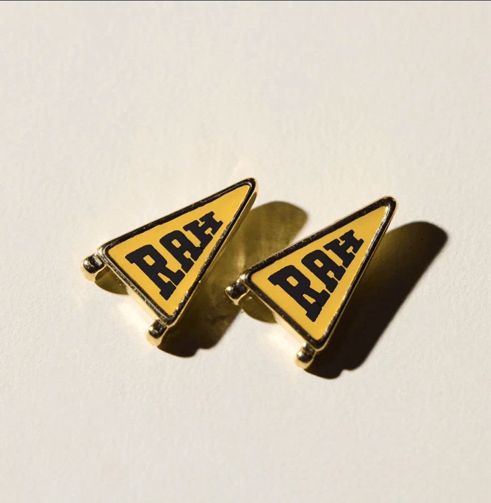 Love these “Rah” pennant studs! So cute for moms with amazing style or teens for school pride 💛🖤