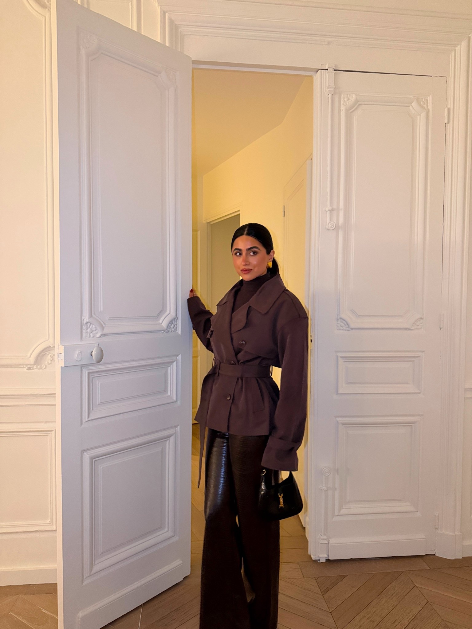 Ootn in Paris wearing brown faux croc pants and a brown crop trench coat 

#LTKTravel