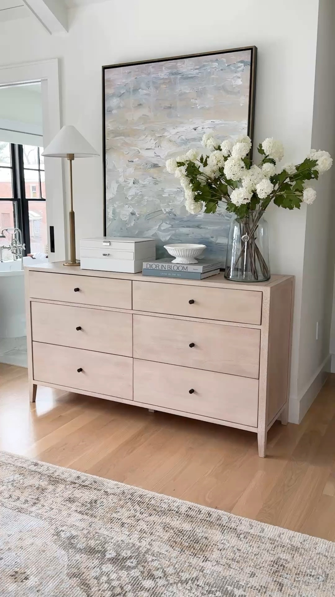 I love this six short dresser from Pottery Barn! The drawers are soft clothes. They have tons of storage and I love the slightly white washed color and modern dark knobs. I paired it with this coastal Art from Lindsey letters Co. I have seven snowball stems in my vase

#LTKStyleTip #LTKHome #LTKWatchNow