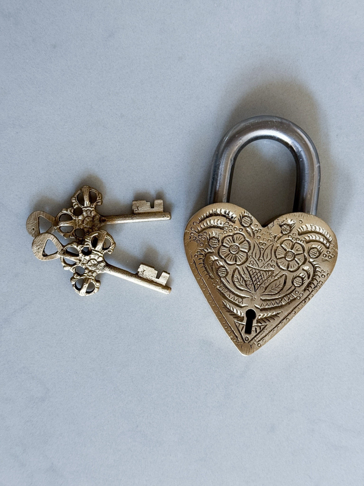 This brass heart lock & key set is one of those small decor pieces that makes a space feel layered & intentional. Vintage-inspired, heavy, & beautifully detailed. It adds character instantly & looks even better in person.

vintage decor - brass decor - heart lock - vintage heart - valentines decor - romantic home decor - european decor - old world decor - antique inspired - coffee table decor - bookshelf styling - entryway decor - neutral home decor - moody decor - collected home - timeless decor - heirloom style - cottage inspired - french vintage - curated home - valentines styling - romantic accents - home accessories - decor details

#LTKHome #LTKSeasonal #LTKSaleAlert