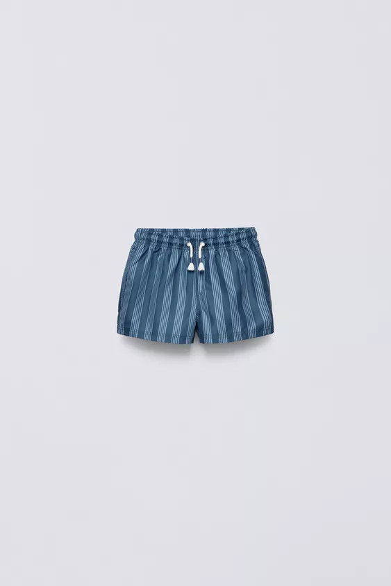 Elastic waistband swimsuit with adjustable front drawstring. Back label appliqué and patch pocke... | Zara US