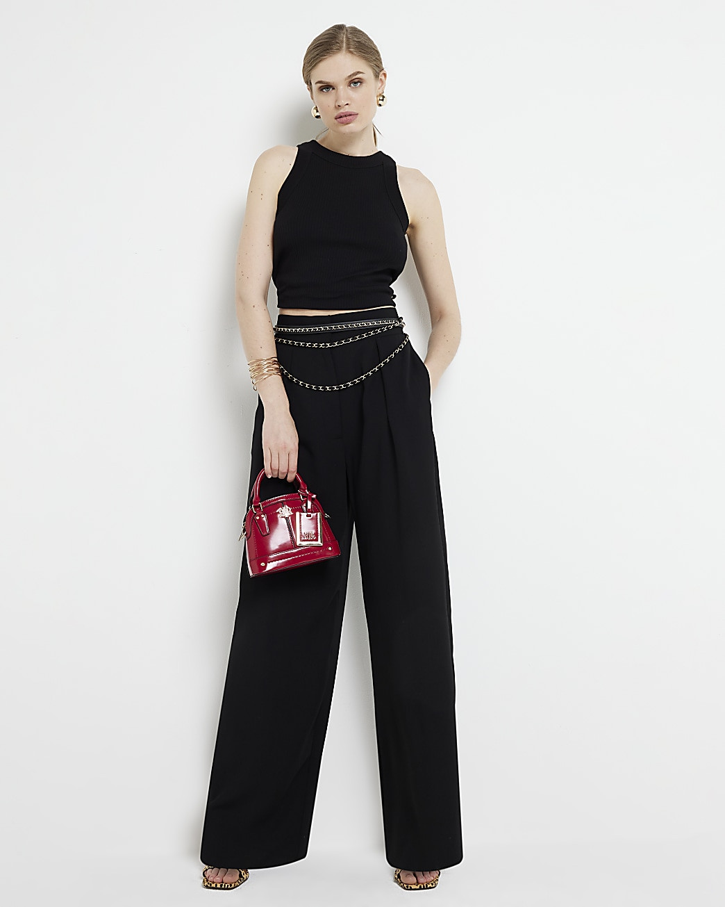 Black pleated wide leg trousers | River Island (UK & IE)