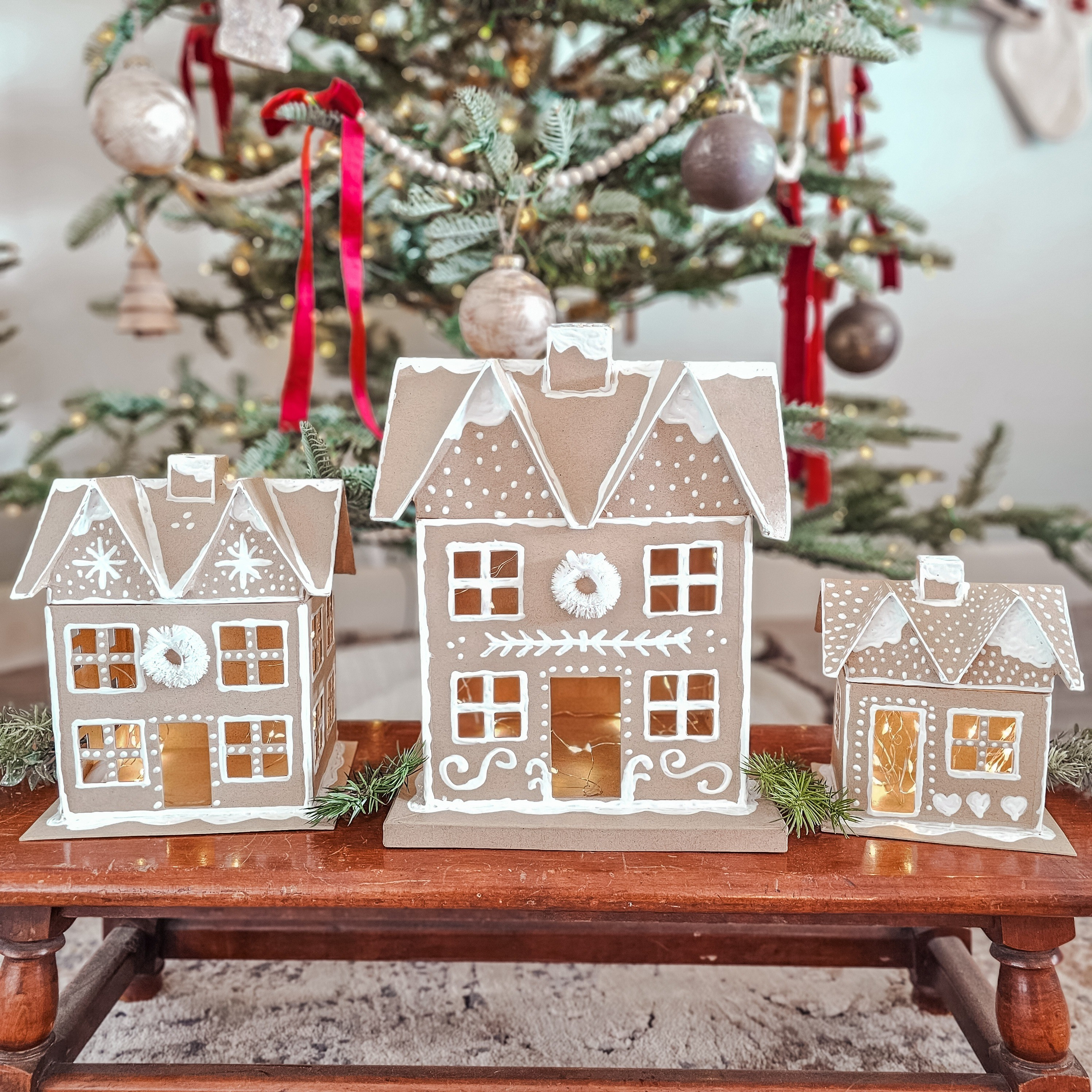 I'm sharing my latest OBSESSION!! These DIY gingerbread houses!! They were so much fun to make!! If you love gingerbread decor, then you'll love making these!!! I made these with the pottery barn ones as my inspiration. But honestly, I love these more!! I added fairy lights, and I'm in LOVE!! Christmas Gingerbread Pottery barn 

#LTKSeasonal #LTKHoliday #LTKHome