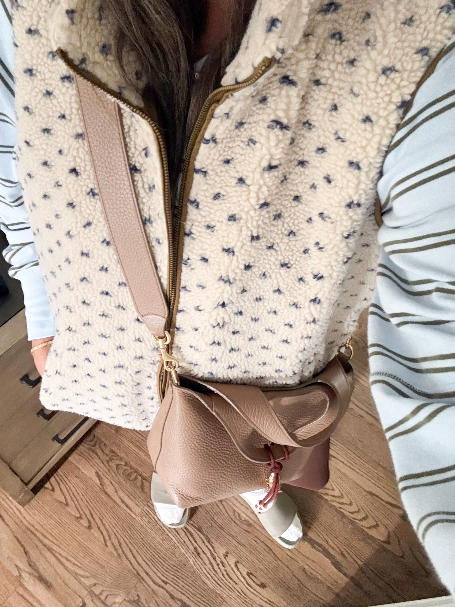 This is such an easy fall outfit formula. The textured sherpa vest, striped layer, and neutral crossbody create a cozy look that feels practical for everyday errands while still pulled together.

sherpa vest, fall layering outfit, striped shirt, crossbody bag, casual fall outfit, women’s fall fashion, transitional style, cozy layers, everyday outfit ideas, neutral fall fashion, mom style, girlonthehudson

#LTKootd #LTKHome #LTKSeasonal