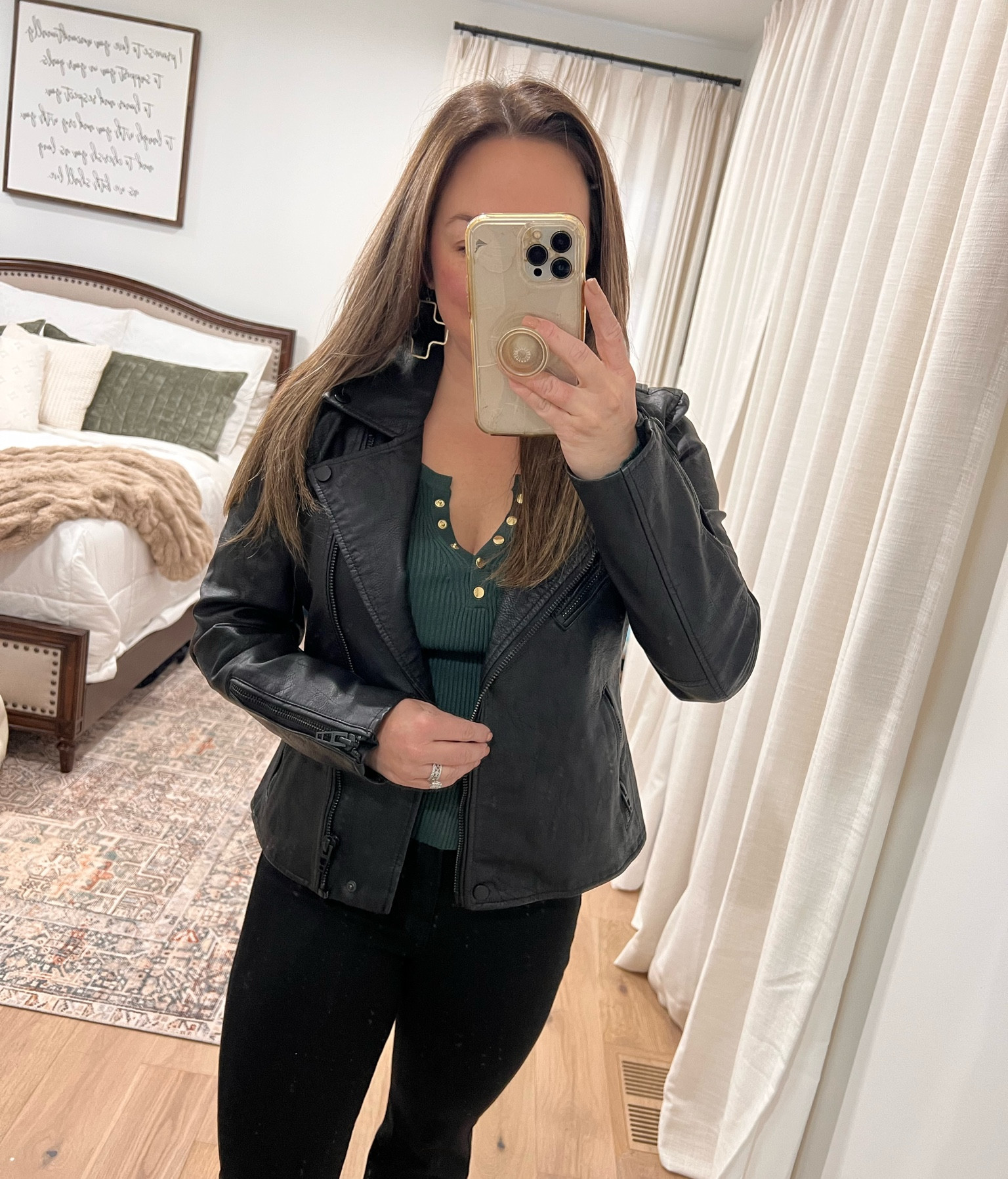 Love this fitted moto jacket by Blanknyc. It’s a pebbled leather with all black details. I’m wearing a medium and have broad shoulders. 

#LTKFindsUnder100