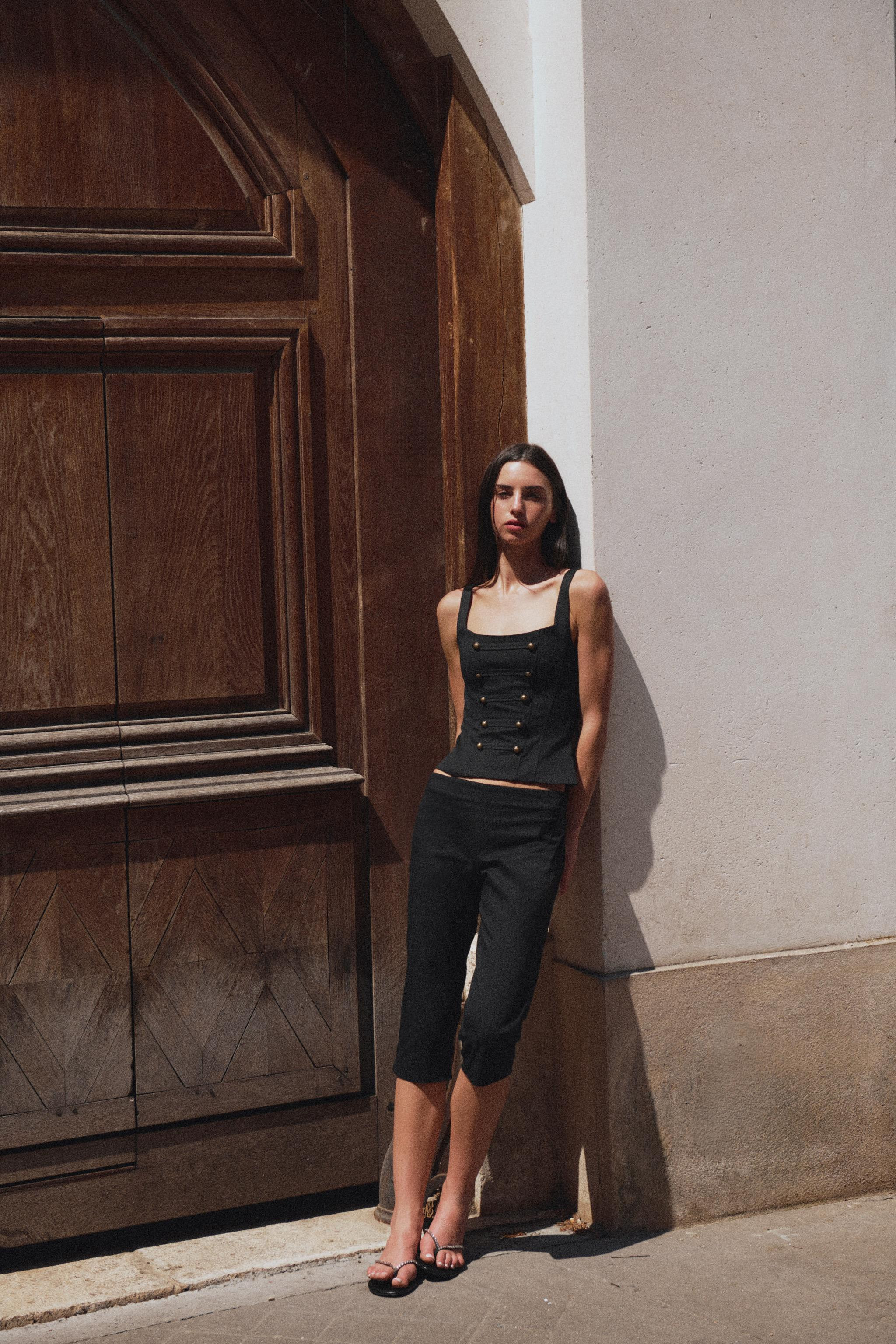 Square neckline top with straps. Features visible seam detail and button appliqu\u00e9 on the fro... | Zara US