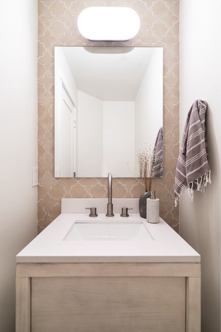 Half bath with minimal styling. 

Frameless mirror, brushed nickel sink faucet, large oversized sconce, and vanity with clean lines. Bathroom styling, bathroom decor, minimalist bathroom decor, powder room. 

#LTKxWayDay


#LTKHome