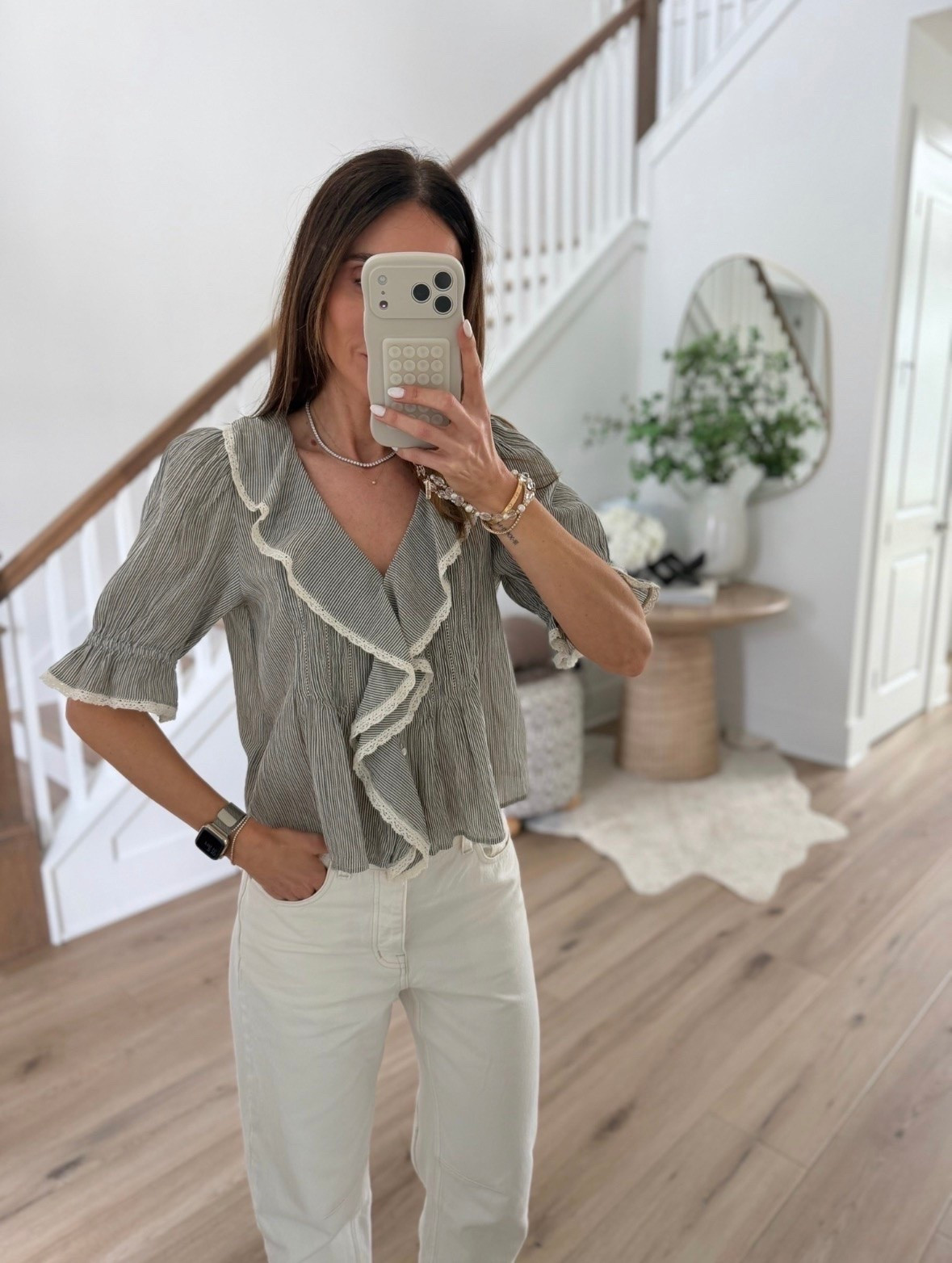 This top feels so feminine and elevated without being too dressy. I love the soft ruffle details with the white denim, it’s one of those easy outfits that still looks styled and put together. Perfect for brunch, vacation dinners, or everyday summer plans.

Ruffle top, feminine style, white jeans outfit, summer tops, chic casual outfits, elevated everyday style, neutral outfits, spring and summer fashion, boutique style outfit, effortless style, casual chic look, vacation outfit ideas, annabrstyle

#LTKootd #LTKSeasonal #LTKOver40