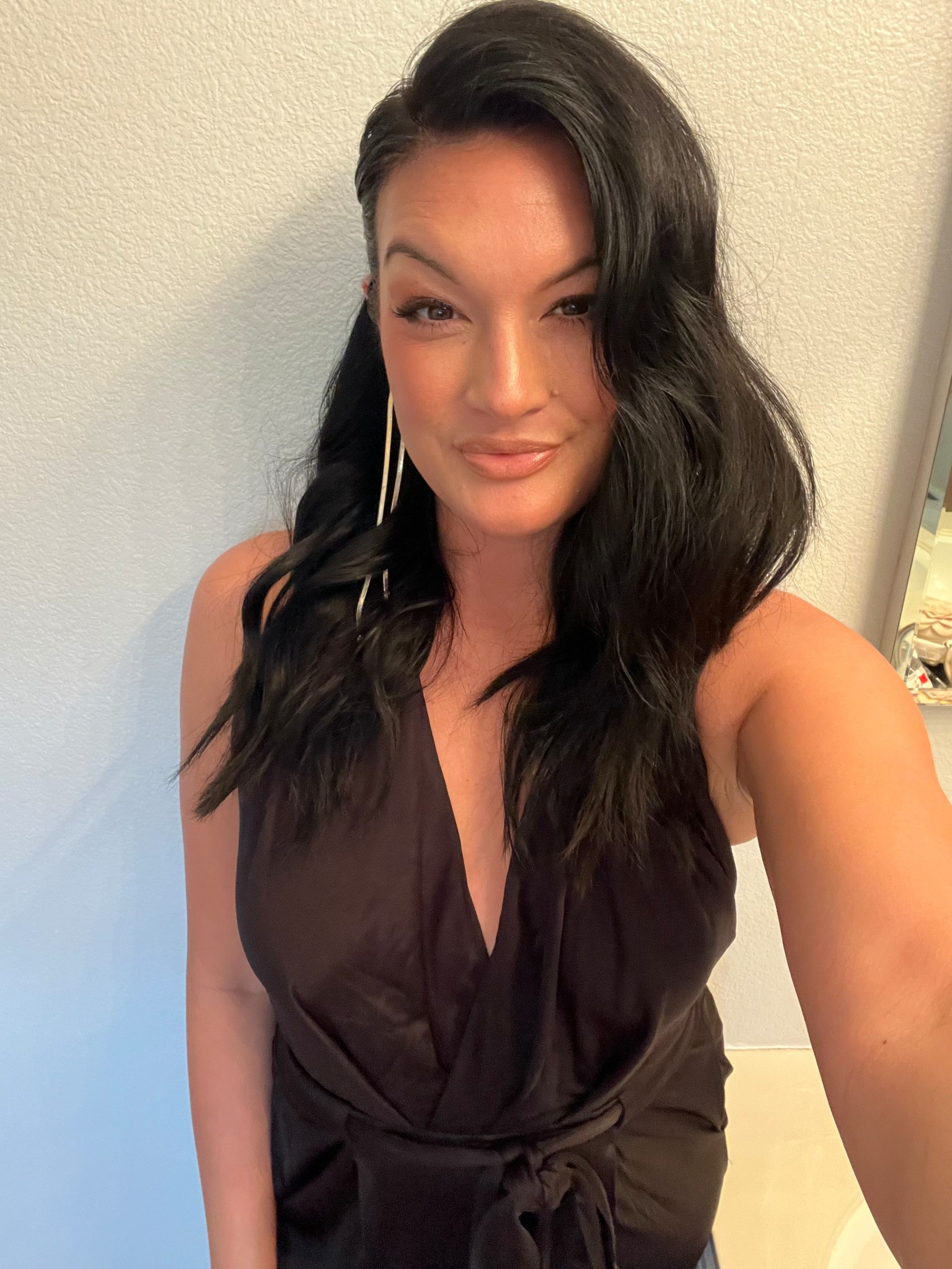 Perfect party, black, STAPLE… halter/belted jumpsuit. Super sexy and classy. I looooove the open back! 🖤 

#LTKBeauty #LTKParties #LTKStyleTip