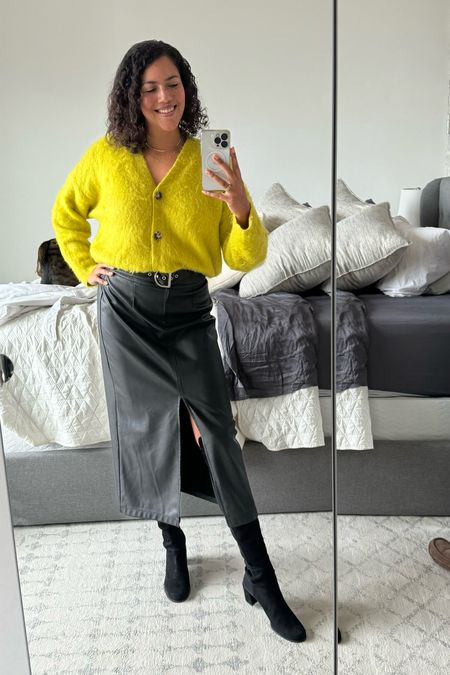 A winter work outfit with a bit of an edge that takes you right out to dinner after the office. A bright, cozy Madewell cardigan (size medium with an oversized fit) tucked into a faux leather midi skirt from Ashley Park for Rent The Runway (size 10). I used a Tucky for this look! Over the knee suede 50/50 Stuart Weitzman boots made for a sleek look and I topped things off with layered necklaces and gold hoop earrings. 

#LTKSeasonal #LTKmidsize #LTKworkwear