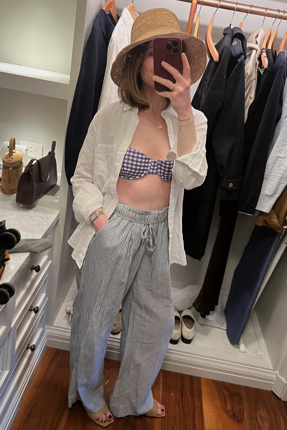 Styling swimwear: J.crew gingham bikini top, J.Crew white gauze button down, Jenni Kayne sun hat, striped linen pants, Aeyde minimal sandals (linked similar options as well) 

#LTKSeasonal #LTKswim