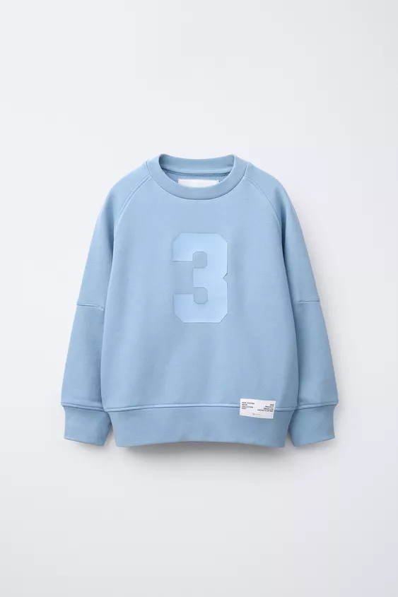 Crew neck sweatshirt with short sleeves. Ribbed trim. Raised number print on the front and raised... | Zara US