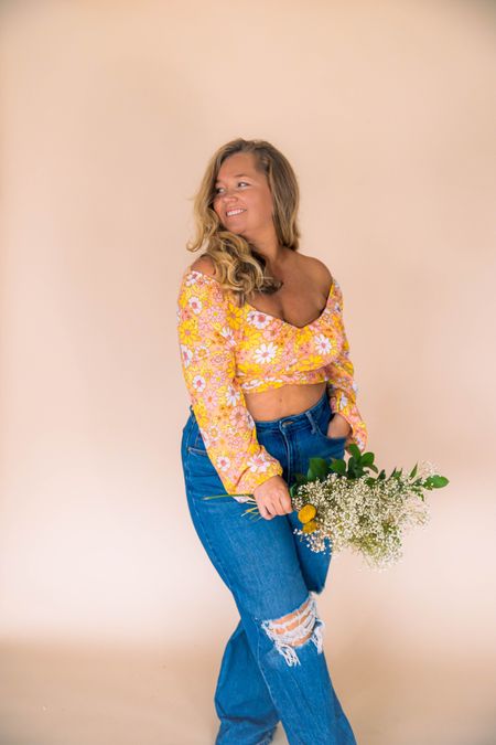 90s style fashion baggy jeans and retro floral crop top paired together are perfect for spring! Size large too and size 12 denim mid size style and great for a festival look! #cutvystyle #midsize #floraltop #baggypants 

#LTKcurves #LTKFestival #LTKstyletip