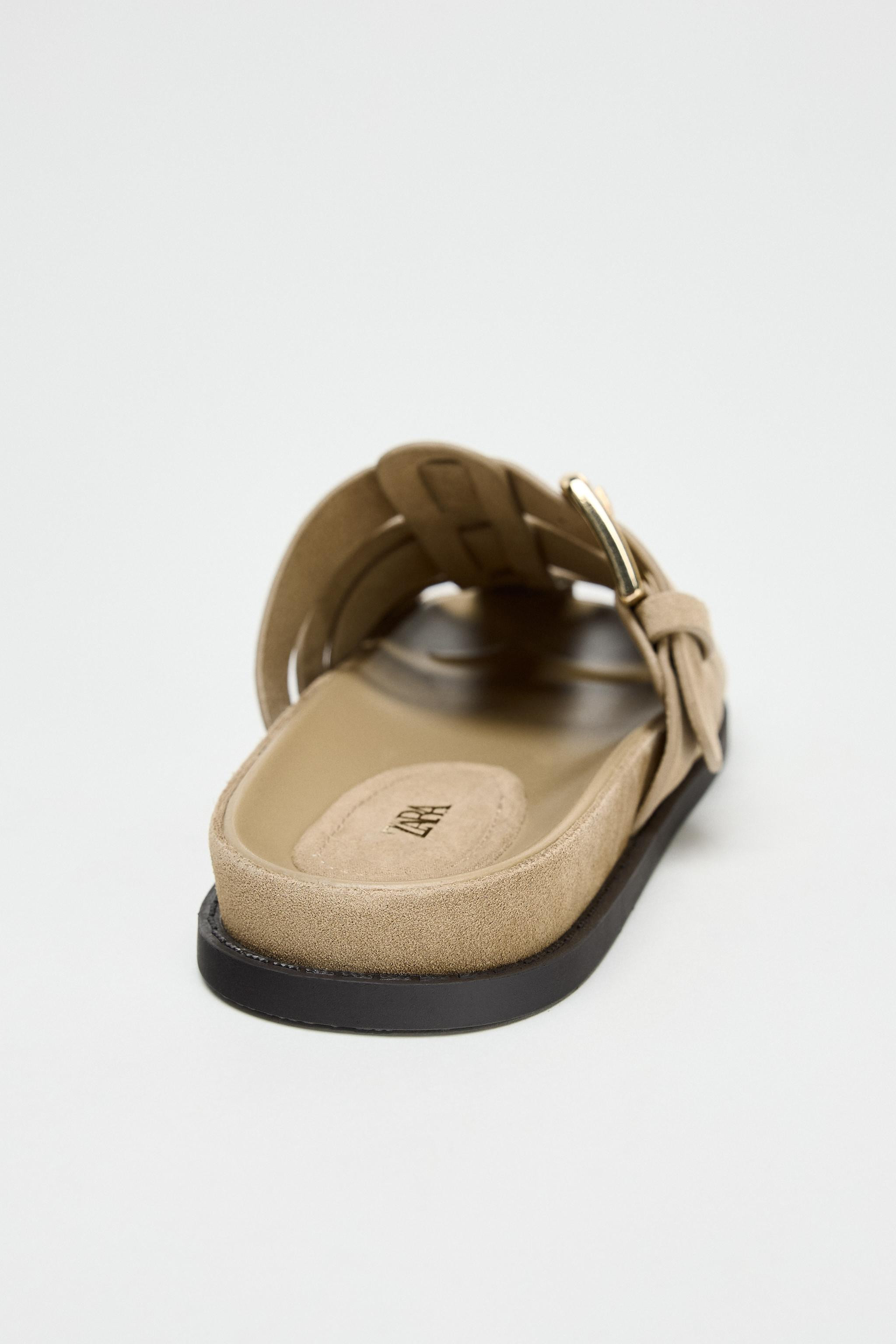 Split suede flat fisherman sandals. Side buckle detail. Flat sole. Rounded toe.Sole height: 0.8 i... | Zara US