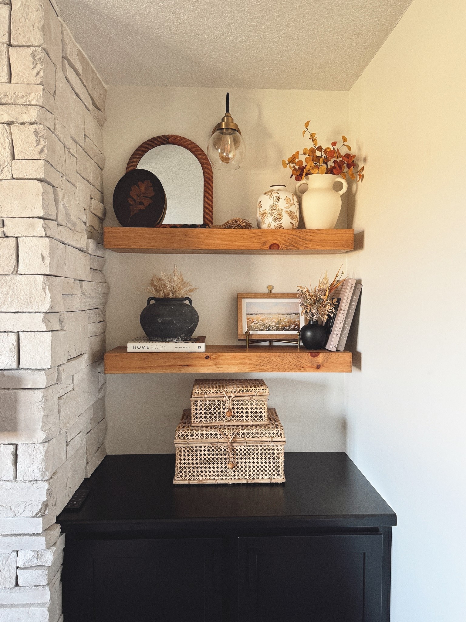 Warm tones + layered textures = instant cozy shelves 🤎 From woven baskets to earthy ceramics and simple art, this nook feels collected and lived-in without being overdone. One of my favorite corners in the house!

#ltkhome #shelfdecor #neutraldecor #cozyhome #homestyling #ltkfinds