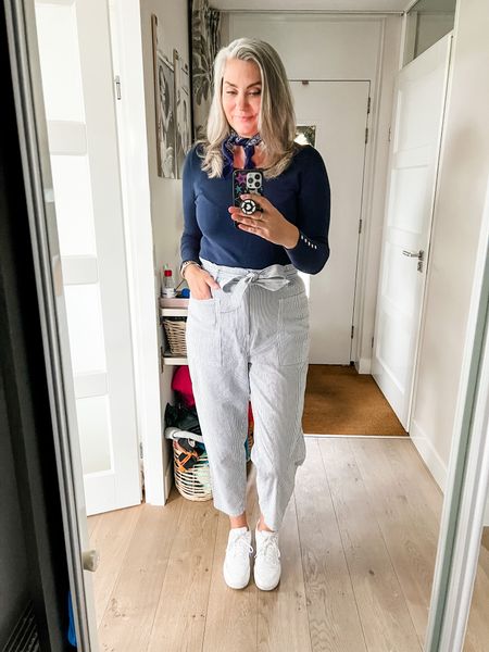 Outfits of the week

A basic navy blue pullover paired with blue and white thin striped paperbag waist trousers and white sneakers. 



#LTKstyletip #LTKeurope #LTKcurves