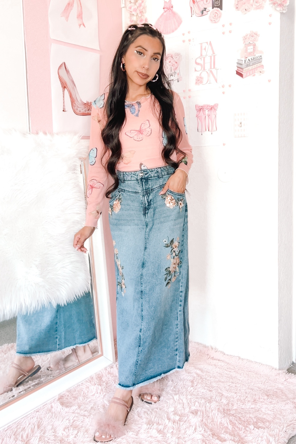 Pink mesh butterfly print tee, denim maxi skirt with embroidered sequin flowers, pink fur sandals, and 90’s hairstyle with butterfly clips. #girlystyle #90sfashion