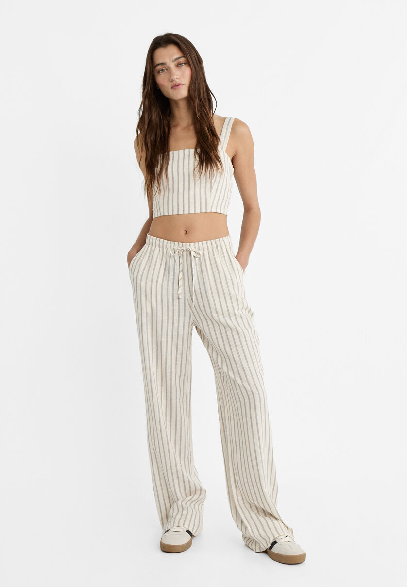 Striped flowing linen blend trousers with elasticated waistband - Women's fashion | Stradivarius ... | Stradivarius (UK)