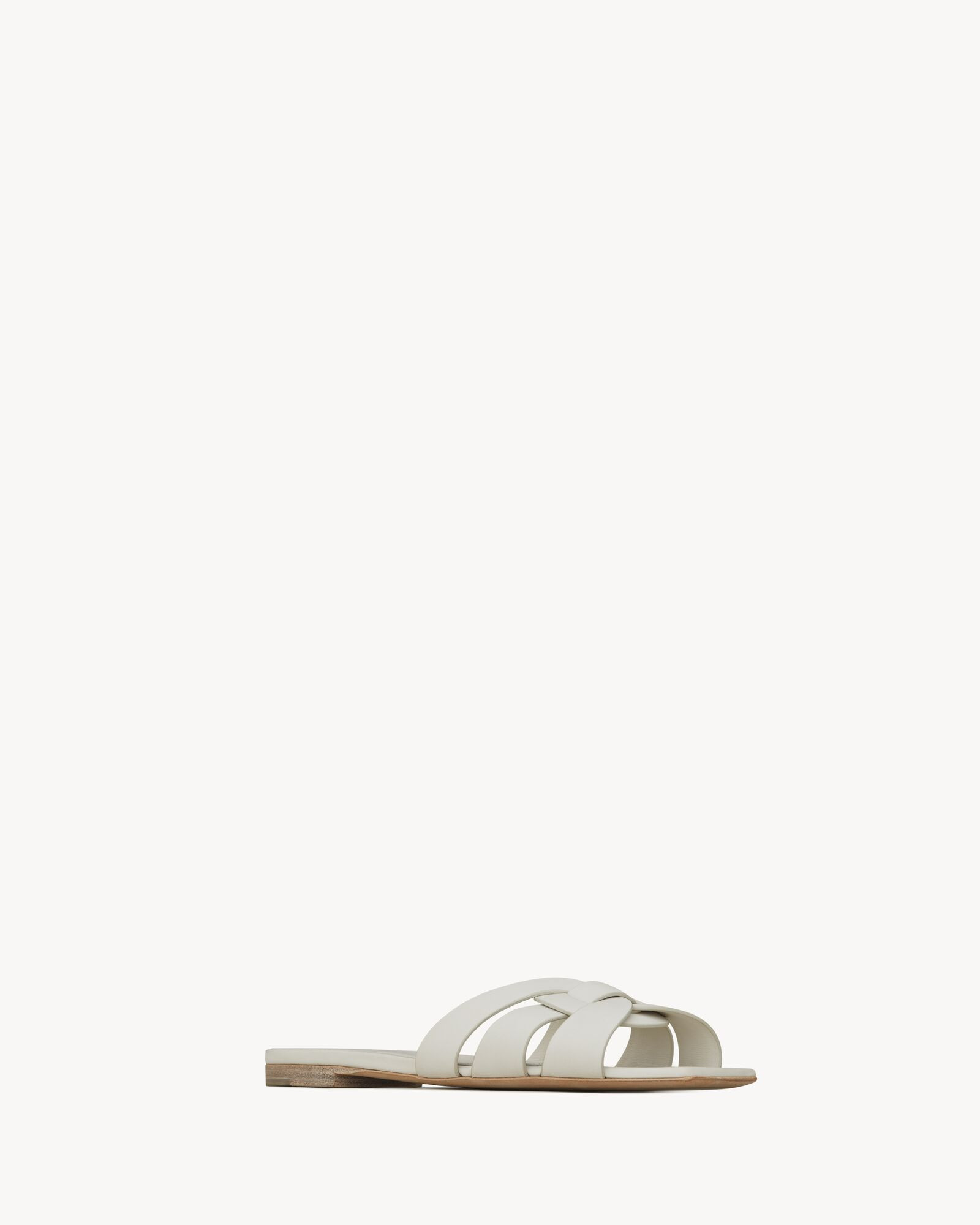Slip-on flat mules with a square toe and intertwining straps. | Saint Laurent Inc. (Global)