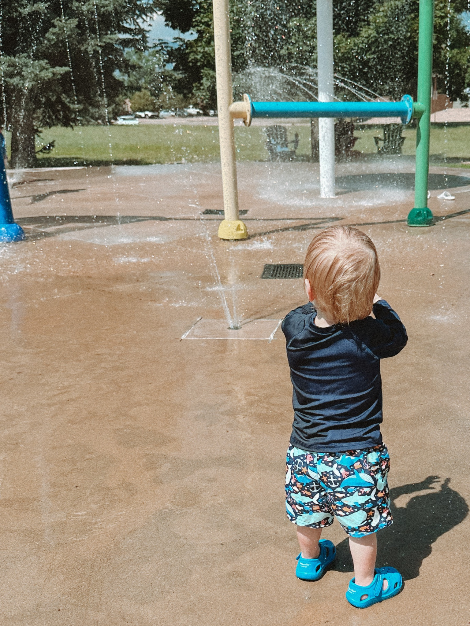 Toddler swim shorts, rash guard, and water shoes at the splash pad

#LTKswim #LTKkids #LTKbaby