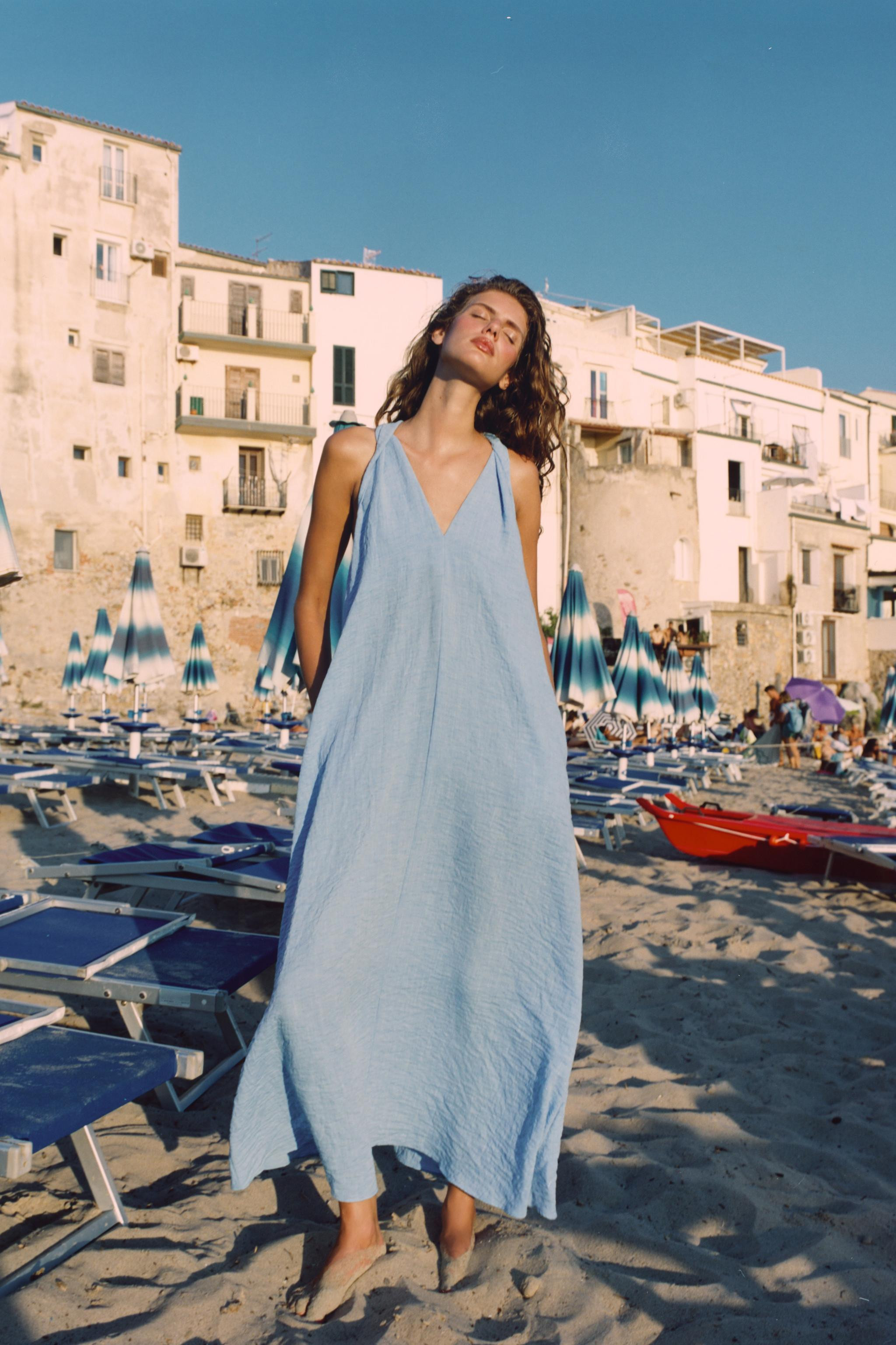 V-neck dress with twisted sleeveless detail. Featuring side in-seam pockets. | Zara UK