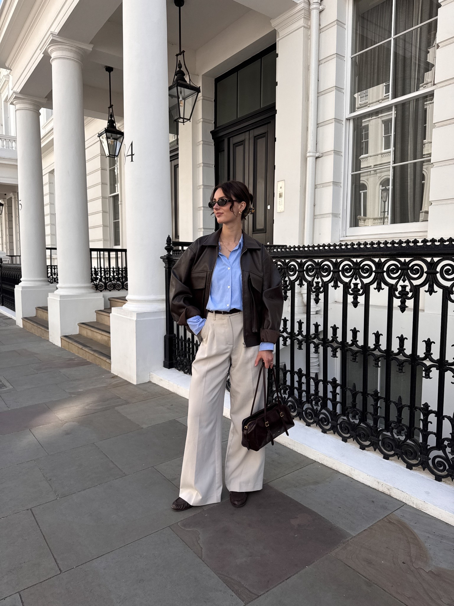 White wide leg trousers with blue shirt and leather jacket 

#LTKuk #LTKeurope #LTKspring