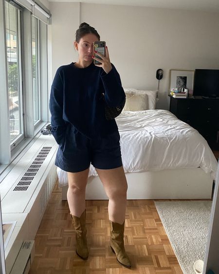 THE transitional fall outfit. Loving a monochromatic navy outfit and styling shorts with cowboy boots lately. ALSO, a sweater styled with shorts means it’s my favorite weather 🫶🏻 

I sized up in the Everlane sweater for an even more relaxed fit and the wide calf friendly boots are *chefs kiss* 

#LTKmidsize #LTKunder100 #LTKSeasonal