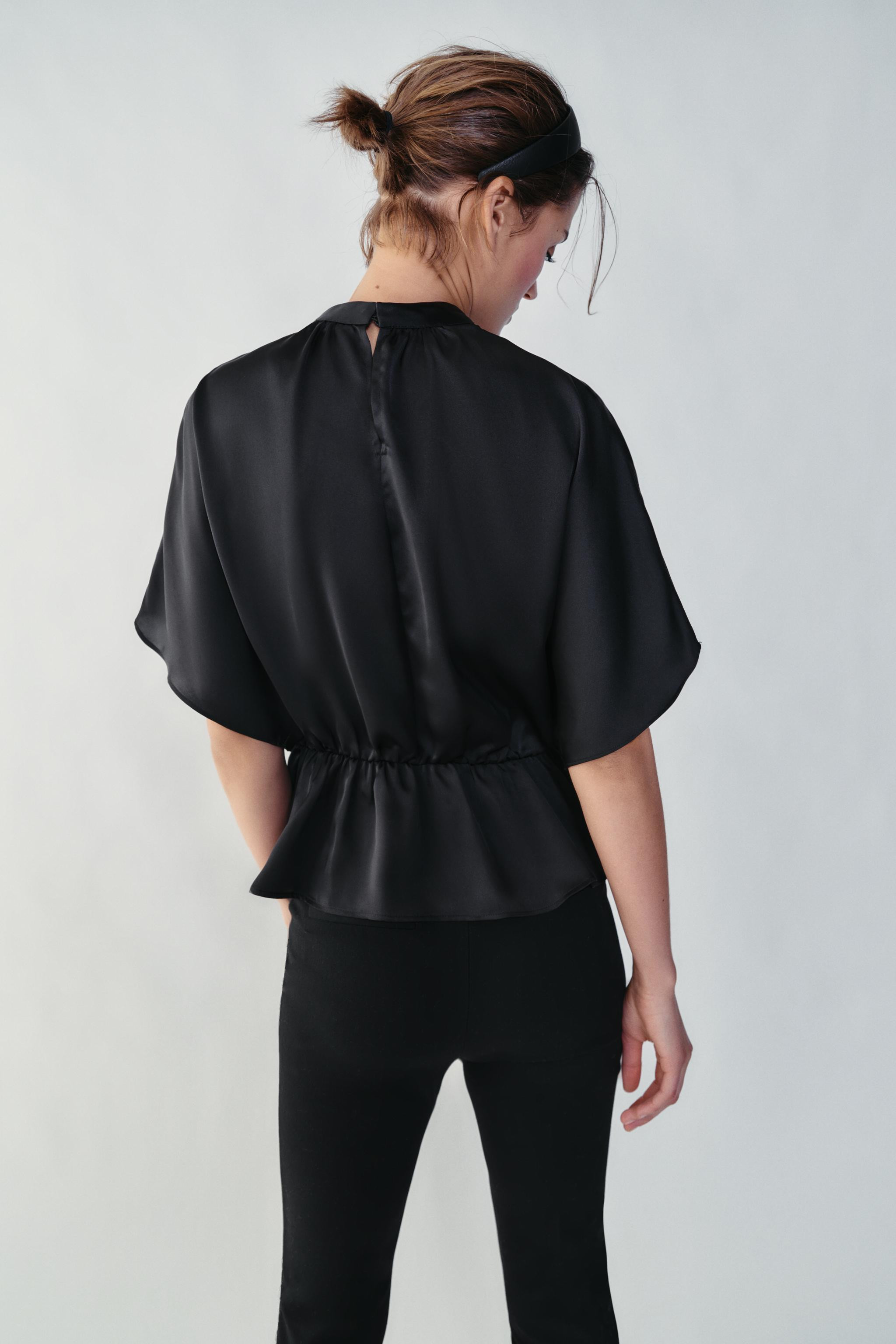Satin blouse featuring a high neck and wide short sleeves. Hem with gathered detail and elastic. ... | Zara US