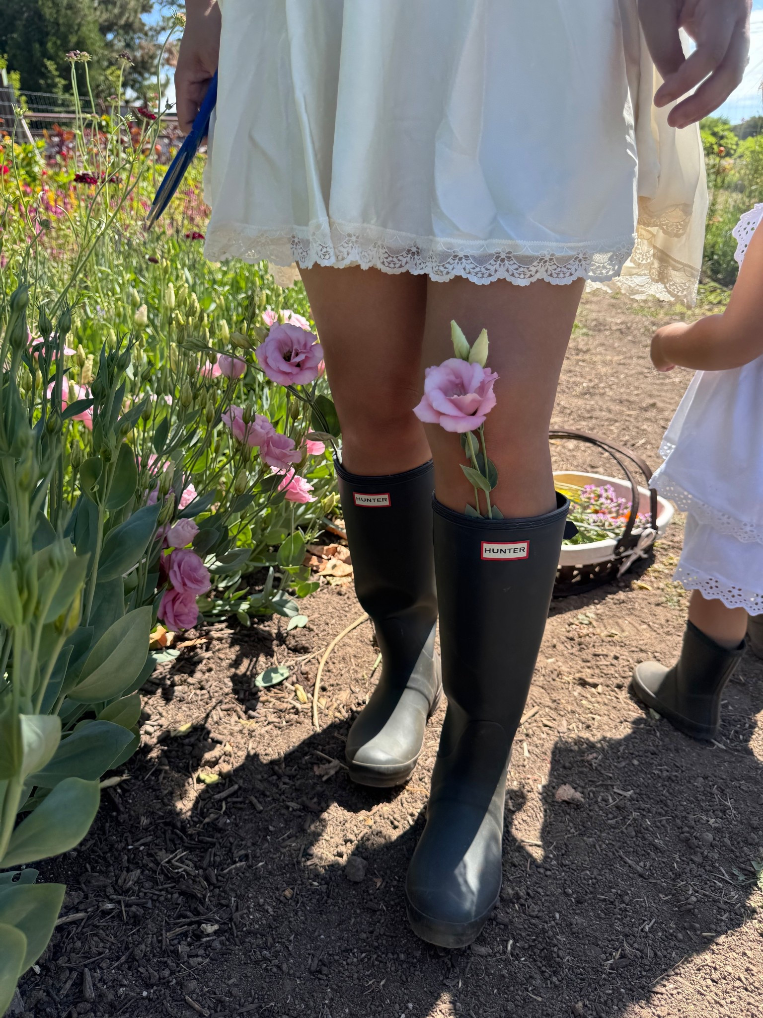 Free people, hunter, farm, hunter, motherhood, boots, flower picking, mommy &amp; me, toddler, girl mom 