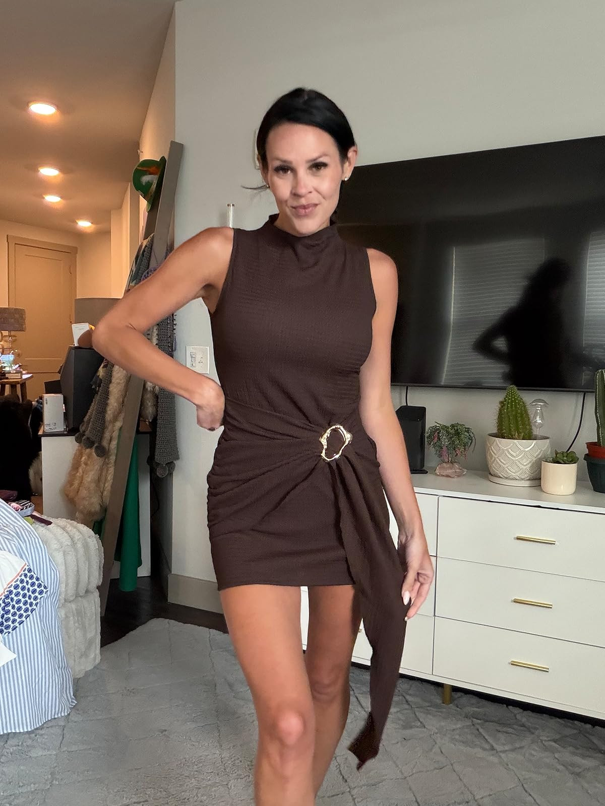 Obsessed with the chic, draped look of this brown high-neck mini dress! The gold ring hardware and ruched detailing make it the ultimate choice for a stylish date night or an evening out. Save this post and click the link in my bio to shop the exact look! #LTKunder50 #DateNightOutfit #ChicStyle 

 #LTKdayinmylife #LTKgrwm #LTKootd