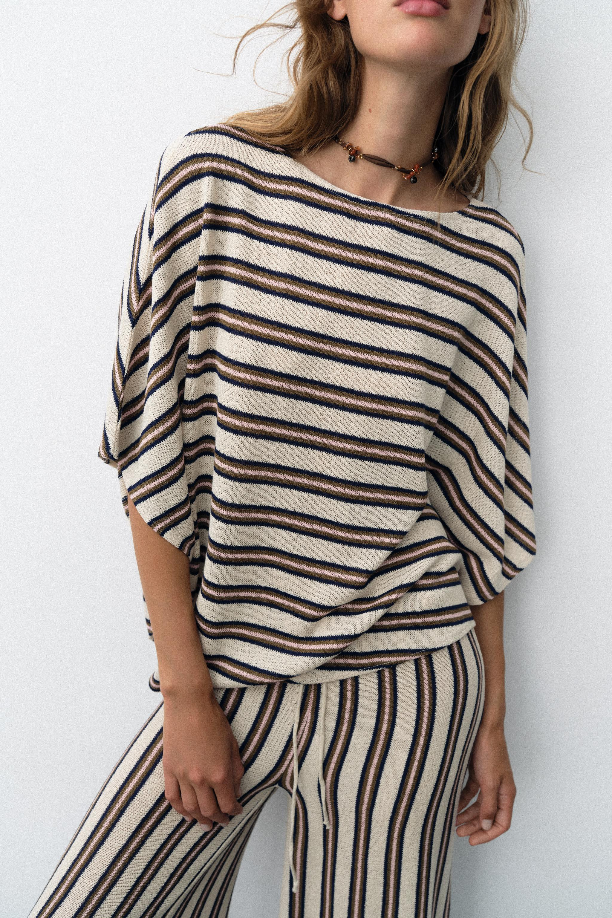 Top crafted from a rustic fabric. Features a boat neck, wide short sleeves and an asymmetric hem. | Zara UK