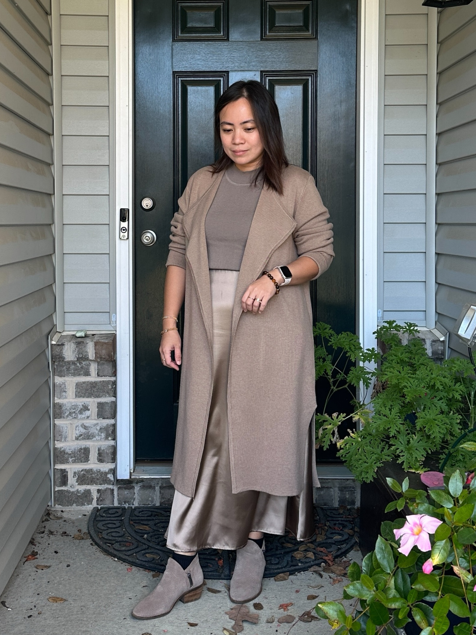 Serving cozy elegance in this head-to-toe neutral look! The long camel coat brings warmth and structure, while the satin midi skirt adds a hint of luxe with its soft sheen. Finished off with ankle boots for the perfect blend of comfort and style.

#LTKStyleTip