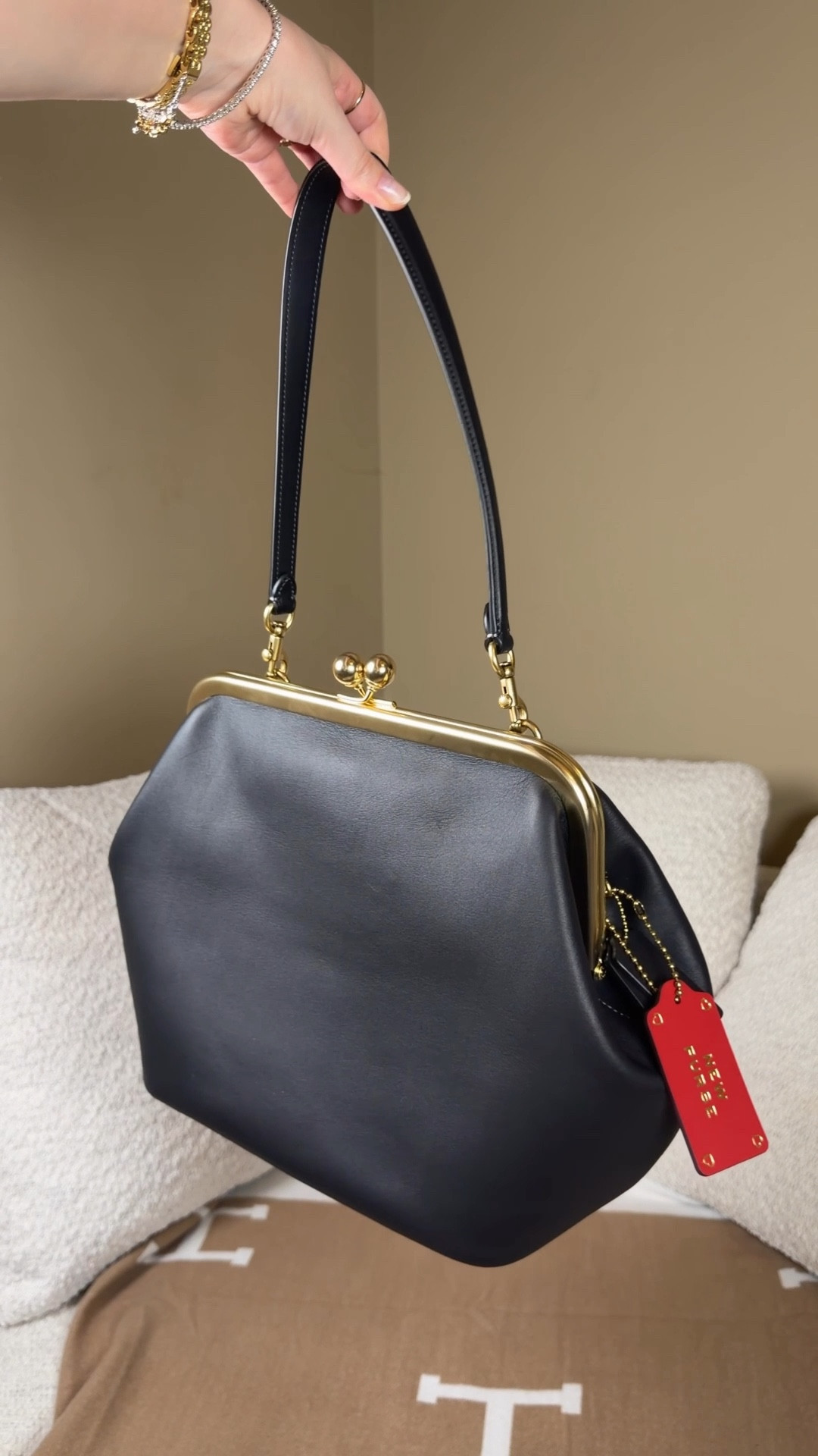 She’s been out of stock but she’s finally back 🖤 I just added a Coach Kisslock to my collection and she is worth the hype!

This is the Coach kisslock 27 which is the perfect size. Not too big and not too small and unlike her little sister, her shoulder strap is detachable so you can customize how you carry her with different types of straps like crossbody, shoulder, or strapless like a clutch. 

I got it in black because I love how Carolyn bessette Kennedy wore big black bags year round even with sun dresses. Such a vibe! ☀️🖤

Comment SHOP below to receive a DM with the link to this post on my LTK ⬇ https://liketk.it/64A5Q #ltkgrwm #ltkdayinmylife #ltkootd