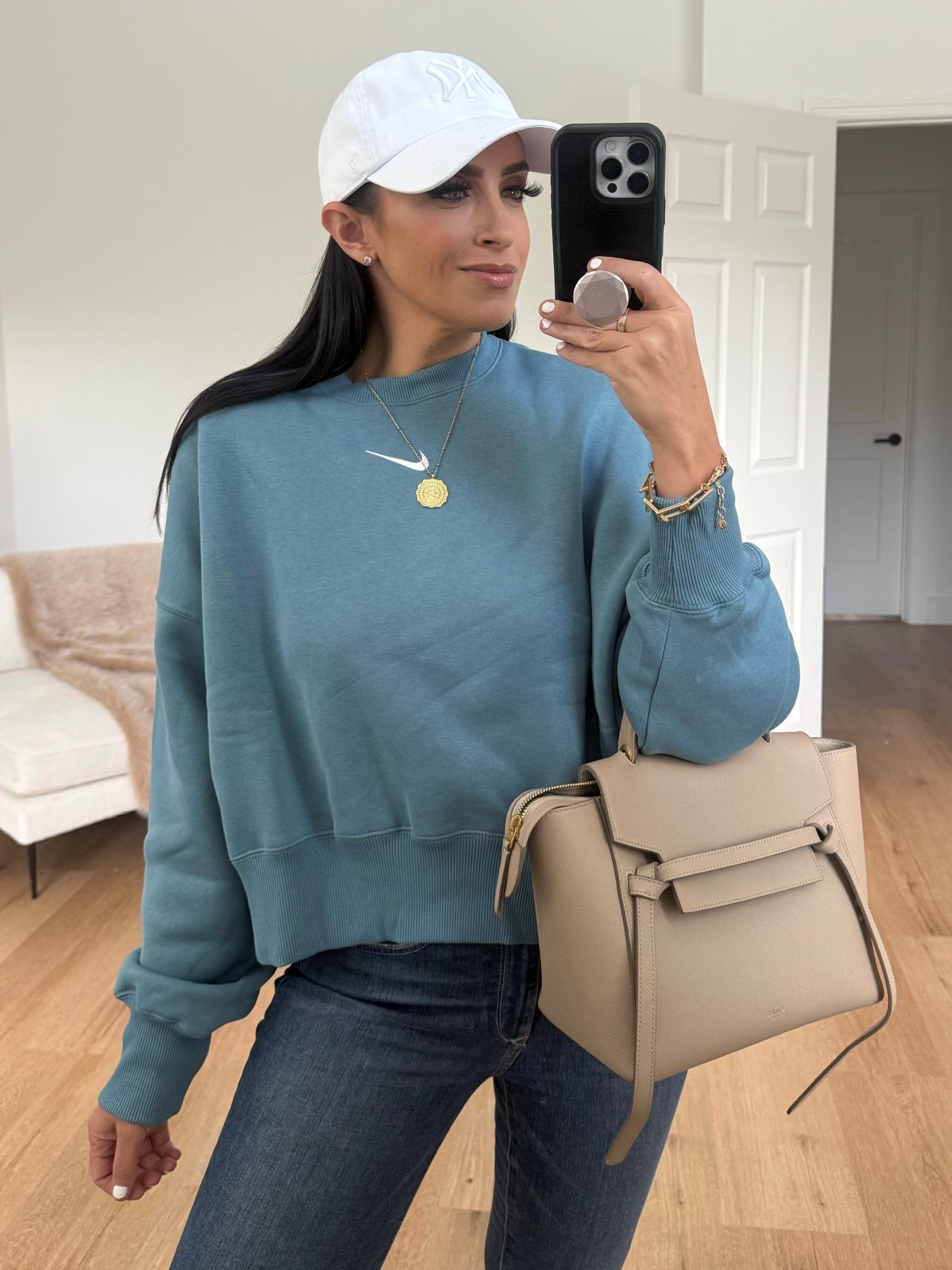 Nike Sportswear Phoenix Fleece
Women's Over-Oversized Crew-Neck Sweatshirt wearing small. Sofia Vergara jeans. Nike Jordans