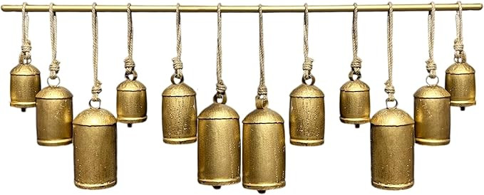Neyra 48 Inch Wide Decorative Iron Cowbells Wall Decor, Antique Gold Finish, Jute Hanging Rope | Amazon (US)