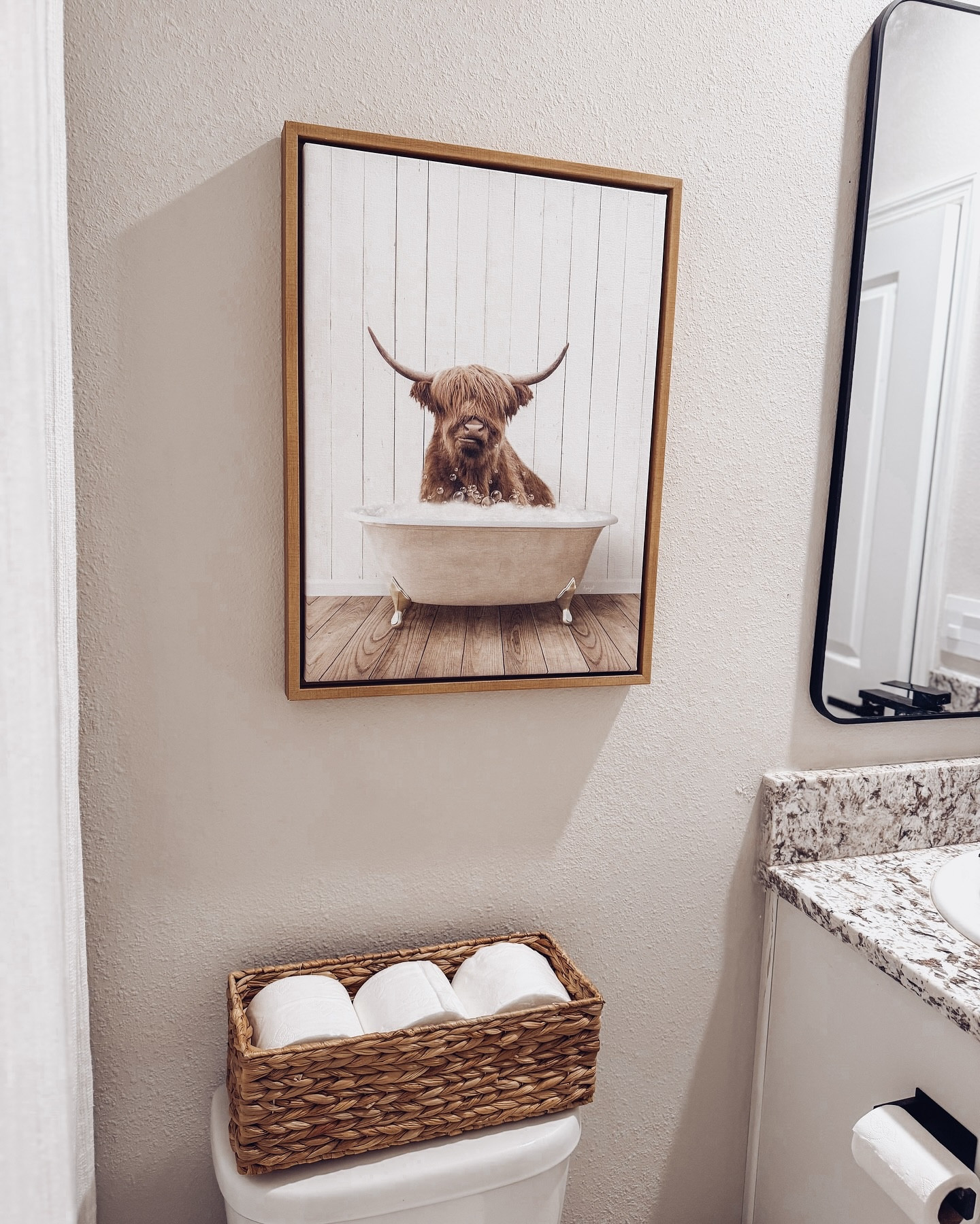 I’m slowly giving my kids’ small bathroom a little upgrade—how adorable is this fluffy cow in the tub? 

First up, we swapped out the sink. And by we, I mean my husband, because apparently, he doesn’t trust me with plumbing. Well played. 😆 Next, I ditched the builder-grade mirror and door hinges for matte black, then added some sleek black handles to the cabinets—because, believe it or not, they didn’t come with any!

Phase II? Adding a faux shiplap nickel gap panel and some towel hooks at their level. Not that it’ll matter… the towels will still end up on the floor. 😆 Anyone else relate?

#homeswithpurpose #neutralhomesofinsta #cozyhomedecor #boujieonabudget #targetstyle #walmartfinds #homedecorinspo #newbuildhome #amazonfinds