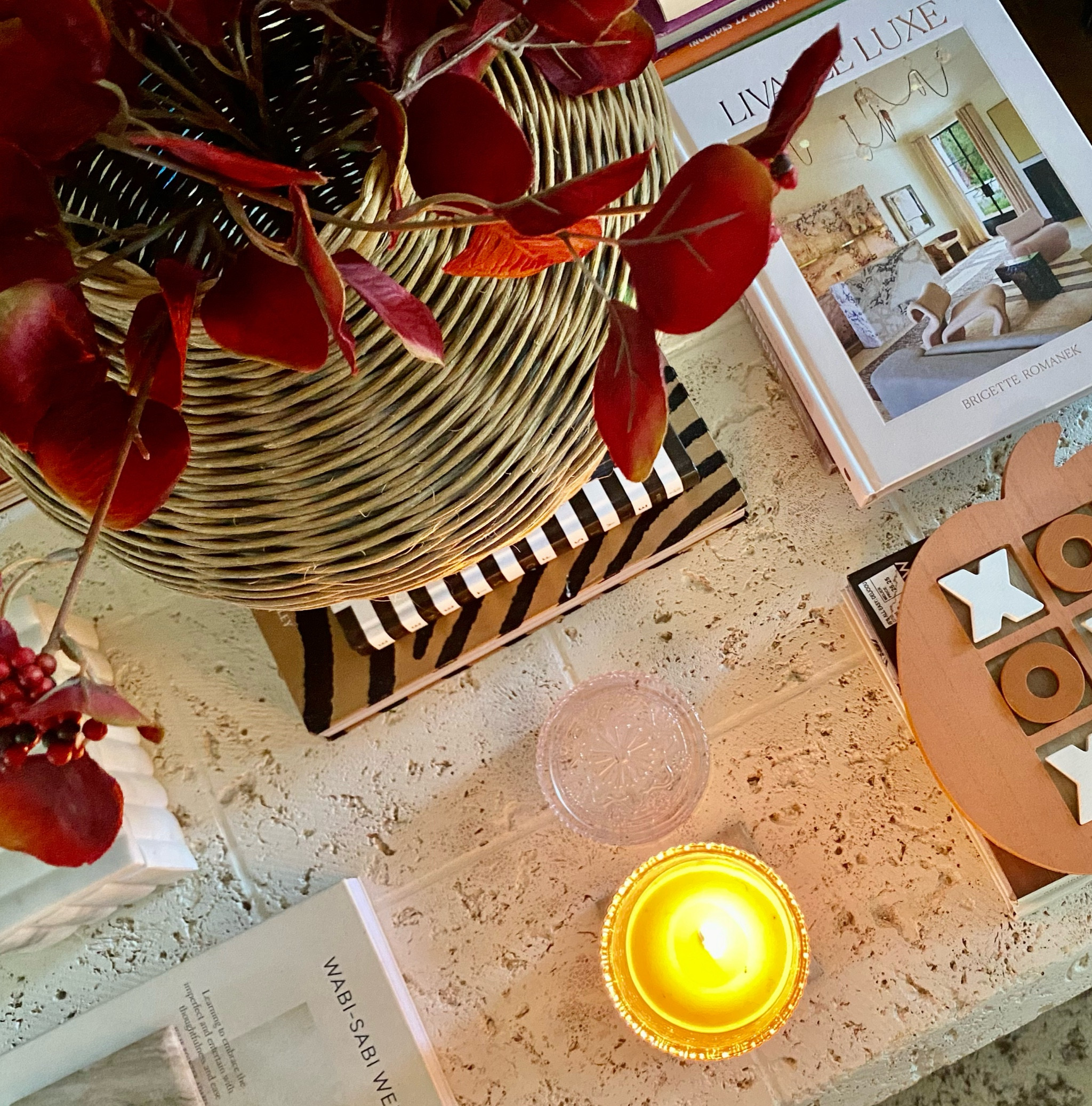 Fall things🍂🍁 Coffee table books. Coffee table styling. Liveable Luxe . Tic tac toe. La Jolie candles. Fall Foliage. Fall flowers. Thrifted basket vase. Wabi sabi welcome coffee table book. Marble box. Travertine coffee table. 

#LTKFindsUnder50 #LTKHome #LTKStyleTip