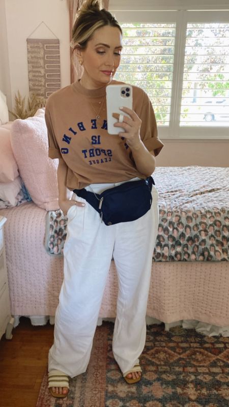 Todays outfit is great for the warmer temps! Love the linen pants. I have them in 3 colors bc they’re so good. Plus they’re super functional & can be worn to work, dinner date, everyday casual or running errands! Add a cute tee & some white sneakers or sandals, a few accessories, grab a denim jacket & you’re good to go! 

#linentrousers #aninebinggraphictee #beltbag #accessories #everydaycasual #workwear

#LTKworkwear #LTKunder100 #LTKbeauty