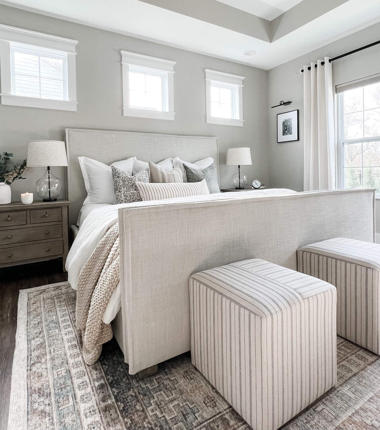 Primary bedroom makeover! 
Colin and Finn / Pillow covers / curated pillows / ottoman / cube ottoman / upholstered bed / highland park bed / Bernhardt / studio mcgee rug / Target rugs / glass lamps / pottery barn nightstands / knit blanket / Esme vase / white vase / bedroom decor / gallery light / linen drapes 

#LTKhome #LTKunder100 #LTKunder50