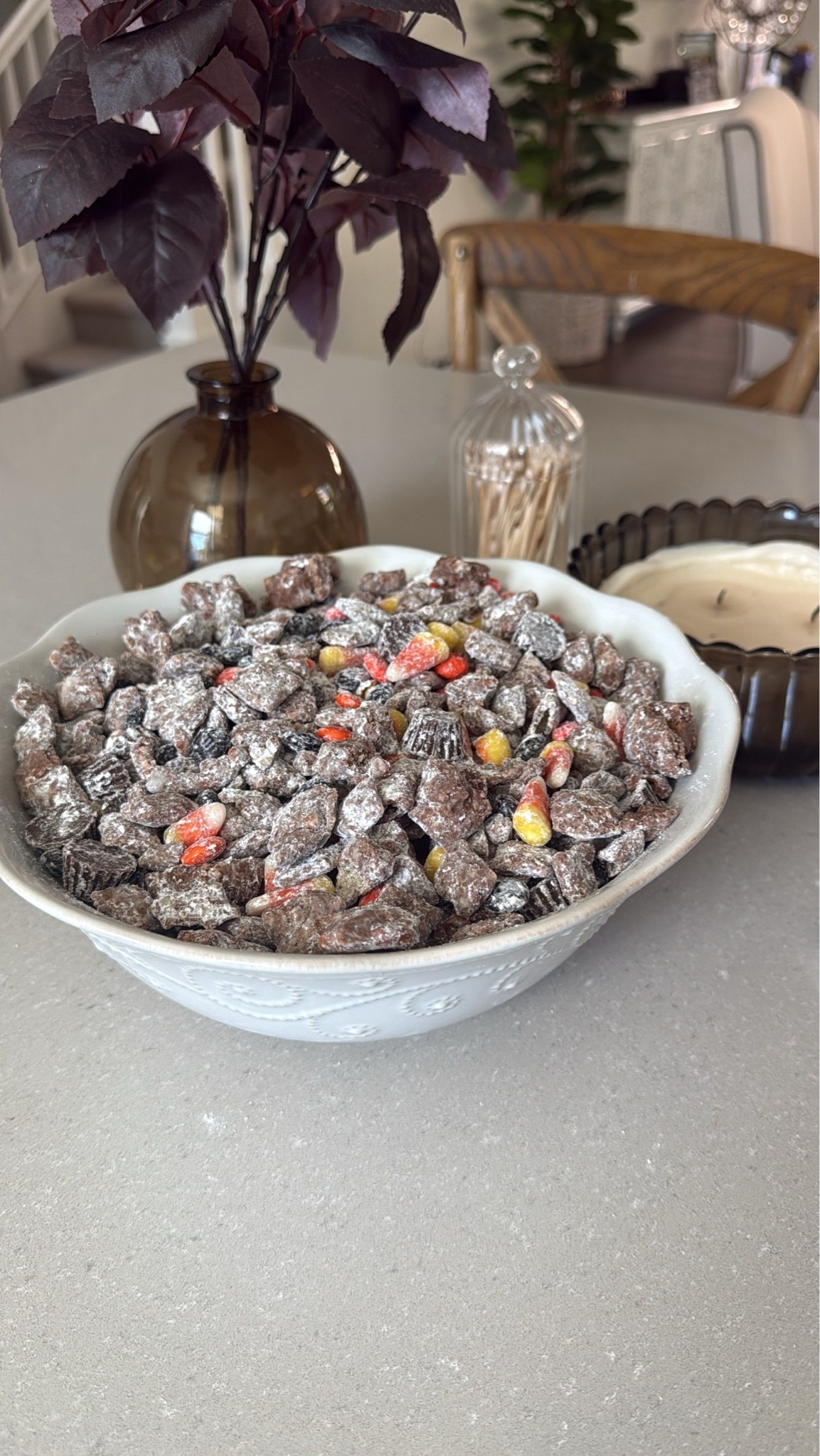 One of my favorite sweet treats with a Halloween twist 💀🎃👻 This would be perfect to bring to a Halloween party! Easy to make and so yummy 😋 
Ingredients
• 5 cups Rice Chex Cereal
• 1 ½ cups semisweet or dark chocolate chips
• 1 ½ cups creamy peanut butter
• 1 ½ cups mini pretzels broken into pieces
• 2 cups powdered sugar
• 1 ½ cups of Halloween M & M’s 
• 1 cup peanut butter cups
• 1 bag of candy corn

In a large bowl, combine rice Chex cereal and pretzel pieces.
Melt peanut butter and chocolate together, either on the stovetop or in the microwave.
Pour peanut butter chocolate mixture over cereal/pretzel mixture and stir to combine.
Chill in the refrigerator until the mixture just barely begins to set up (about 30 minutes).
Remove the mixture from the refrigerator.
In a separate, large bowl, put ½ cup powdered sugar on the bottom of the bowl. Add half of the chilled mixture, then add another ½ cup powdered sugar over the cereal and the remaining chocolate/cereal mixture.
Gently stir until the powdered sugar is evenly distributed, tossing to coat the cereal with powdered sugar.
Chill the mixture again in the refrigerator until it’s set (about another 30-60 minutes).
Add more powdered sugar, ¼ cup at a time until the cereal/pretzel mixture is coated.
Add M&Ms, candy corn and peanut butter cups and stir to combine.
Transfer to a serving bowl and serve.

Amazon, Target, puppy chow, Halloween puppy chow, Halloween snacks, Halloween party, Halloween hosting, reindeer food, seasonal treat, kids snack, Halloween dessert