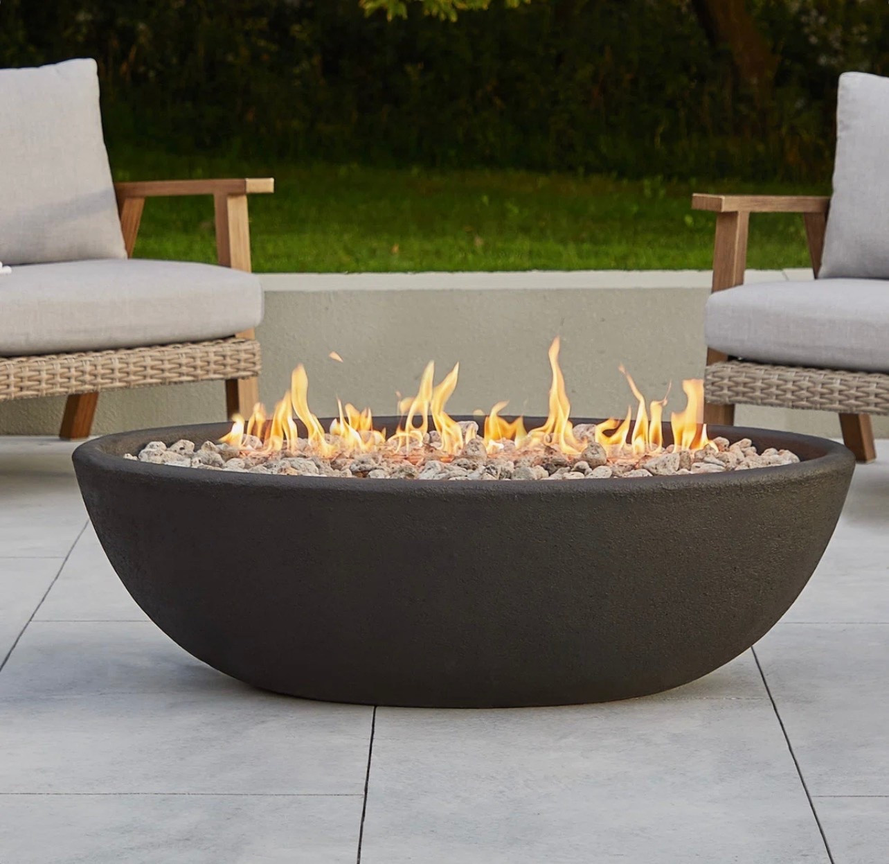 Patio fire pit that looks stunning! Great for entertaining and family nights! 

#firepit
#entertaining 
#patio 
#outdoorliving

#LTKHome #LTKSeasonal #LTKSaleAlert