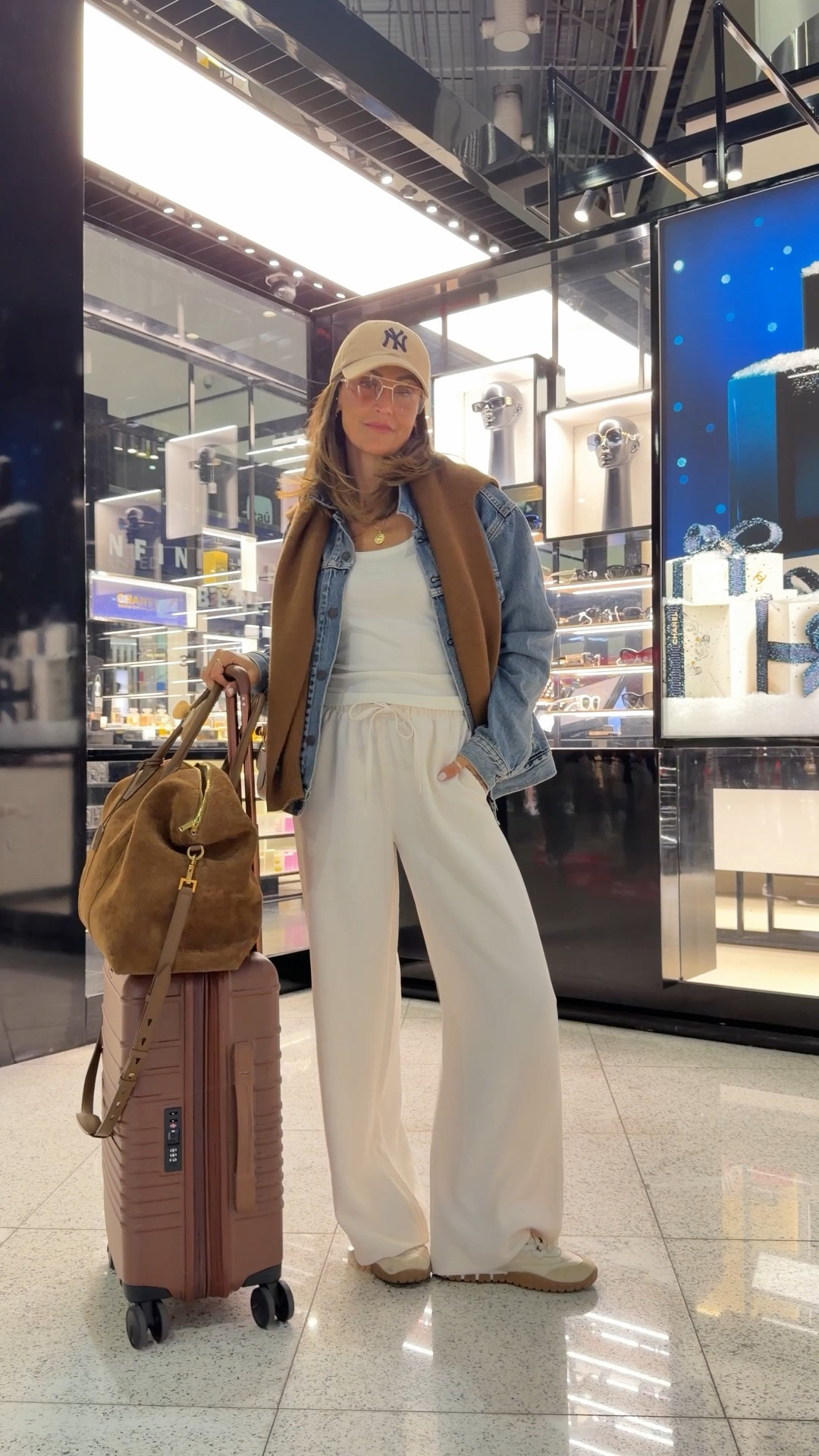 Airport Outfit 🤎✈️ comment AIRPORT OUTFIT and I’ll send you links to shop the look! 

Pull on pants, oversized denim jacket, miu miu sneakers, suede duffle bag, Beis luggage, airport outfit 

#LTKTravel #LTKootd #LTKdayinmylife