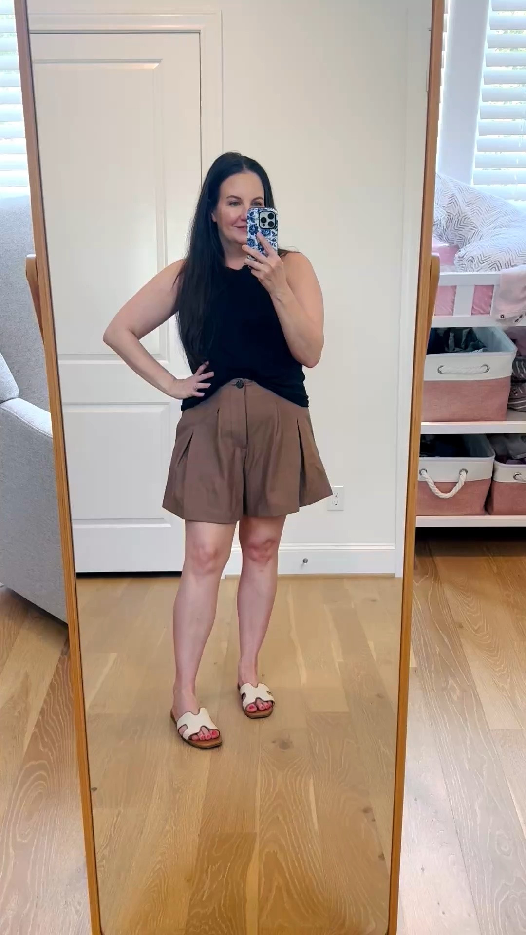 Keeping summer dressing easy with this summer outfit featuring lightweight, linen-like brown trouser shorts and a classic black tank top. The tailored shorts make a simple tank feel instantly more polished while still keeping things comfortable for hot weather dressy casual fashion. 

This is such an easy mom style look for everyday errands, lunch dates, or summer plans, and both pieces would be perfect for vacation outfits too. A simple, elevated combination you can wear all summer long!

#LTKSeasonal #LTKOver40 #LTKootd