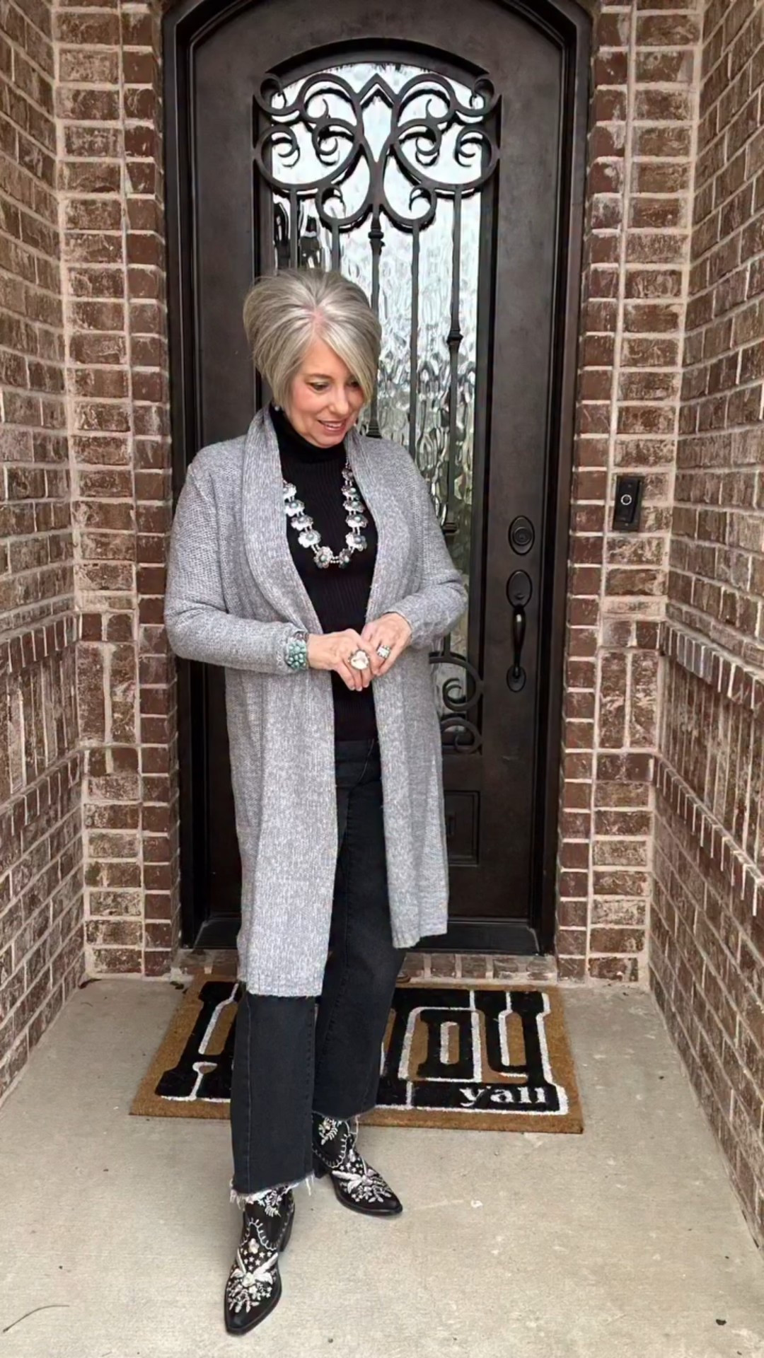 Nothing fancy, just a simple base and intentional details. 

One of my favorite outfit formulas is a solid column of color with a layering piece on top. Here, the black base pieces are slimming,  while the grey cardigan adds interest, and the boots and jewelry finish it off with some Western flair. 

#westernfashion #fashionover50 #westernchic #ootd #styletips