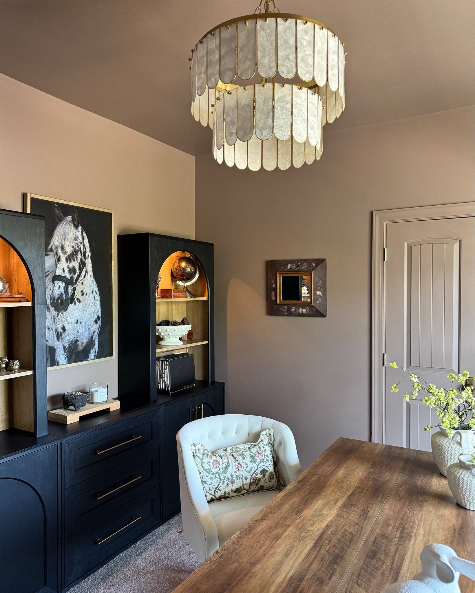 My Moody Study!! The color drenched walls are Porcini by Benjamin Moore🤎
I pinch myself every time I walk in.

Chandelier, desk, chair, horse art, Mopio Blake storage system, bookcases, dressers, office units, vases, spring stems, mortar, candle, matches, pedestal, grapevine balls, marble sculpture, antique brass doorknob 


#LTKHome #LTKstorytime #LTKSeasonal