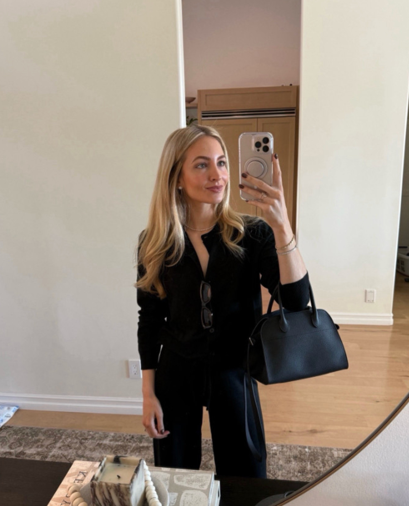 Black cardigan, black bag 

 #LTKHoliday #LTKgrwm #LTKootd