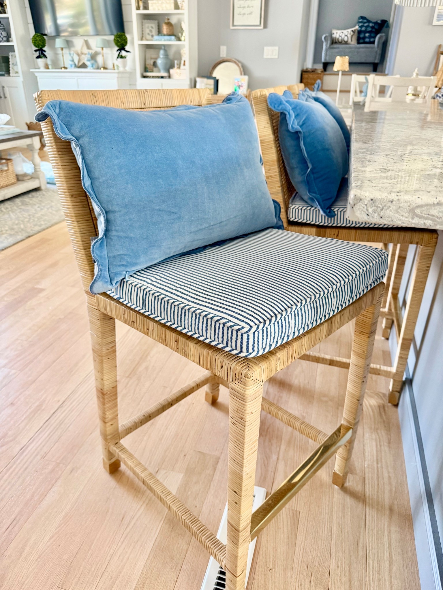 our kitchen island got an upgrade🤩😍

i’ve been eyeing these @serenaandlily balboa stools for years- it was finally time to switch things up & grab them during their recent sale! 🩵

we went with the french blue pinstripe cushions to add a pop of color and pattern in the kitchen. we also paired that with these blue scalloped pillows that provide added comfort & just look so cozy🤍 

the blue pillows are currently sold out- but are available in green! 💚

#LTKHome