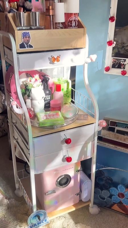 I got this makeup storage cart so l can have all my extra makeup within reach of my vanity. It JUST fit my mini beauty fridge too. The top of the organizer is nice because you can fill it with makeup brushes, perfume, skincare products, etc. it would make a good art / hobby cart too. It has wheels on the bottom and was really easy to put together. I added the cherries, butterflies, mushrooms, and prison mike to go with my space more. 

🎀I also linked my vanity, other cute vanities I found, and more makeup storage solutions. 


#makeuporganizationforsmallspaces #vanityorganizationtips #vanitybedroomideas #vanitydecor #vanityorganisation #organizemybedroom #maximalistbedroom #skincareorganizer
#perfumeorganizer #apartmenttherapy #cozyhome #cozybedroom #urbanoutfittershome #uohome #makeupvanity #whimsicaldecor

#LTKBeauty #LTKFindsUnder100 #LTKHome