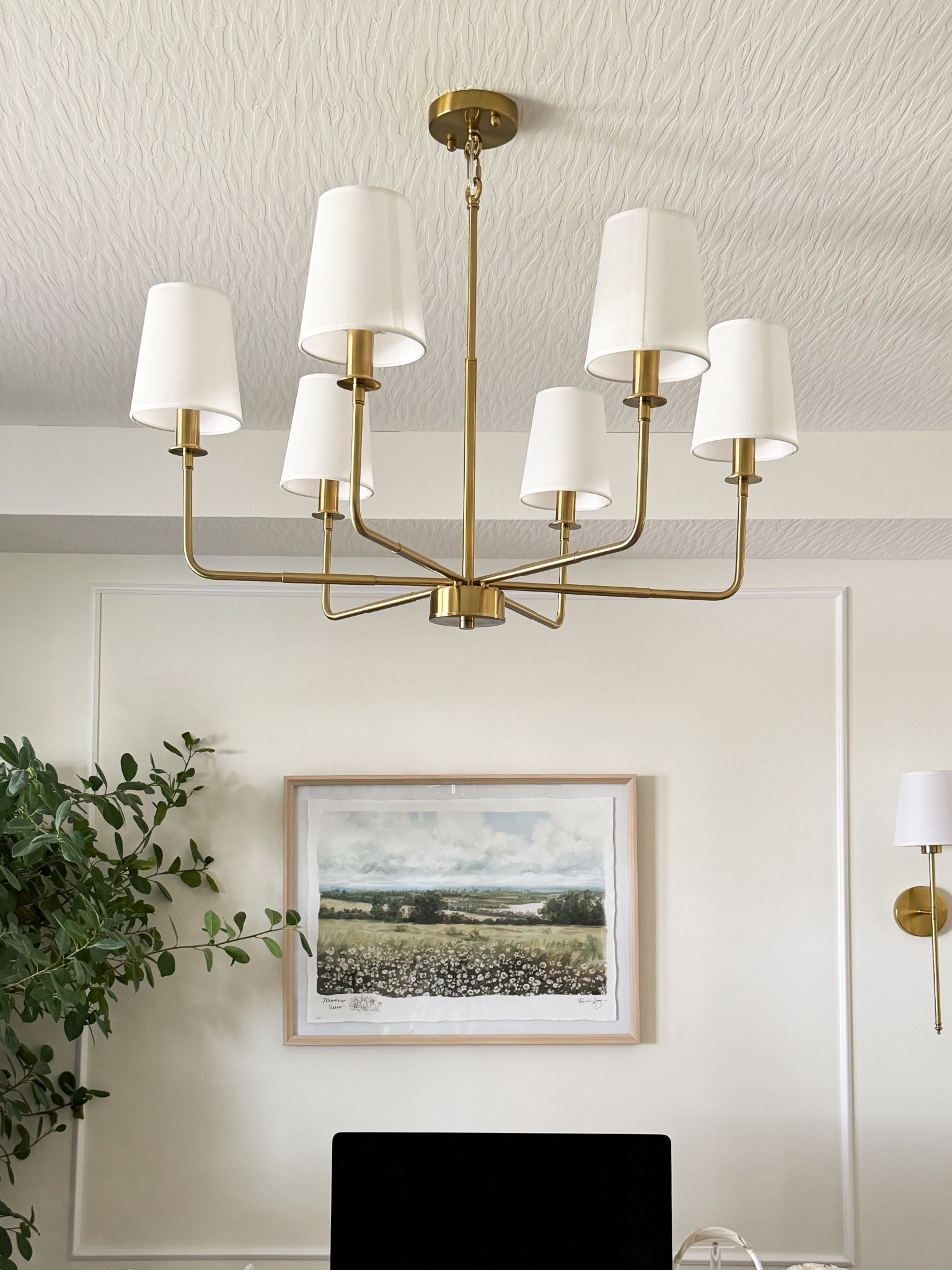 The lighting detail that changed my entire home office ✨ Shop this brass chandelier, matching wall sconces, framed landscape art, faux tree, and neutral office decor for an elevated designer-inspired workspace. Warm brass lighting + soft neutral tones make any office feel cozy, polished, and expensive. #lightingideas #homeofficedecor #neutralhome #chandelier #ltkhome

#LTKHome