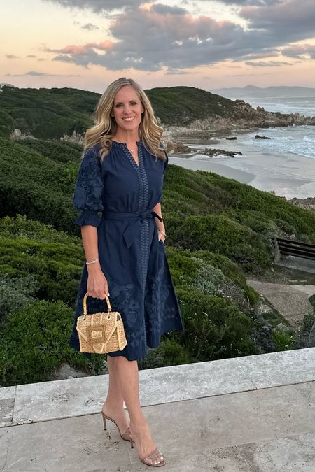Taking in the sunset on the coast in Hermanus South Africa

Navy floral embroidered Julia Amory dress 
Fits TTS 

Pamela Munson Raffia Bag 

#LTKStyleTip #LTKSeasonal #LTKOver40